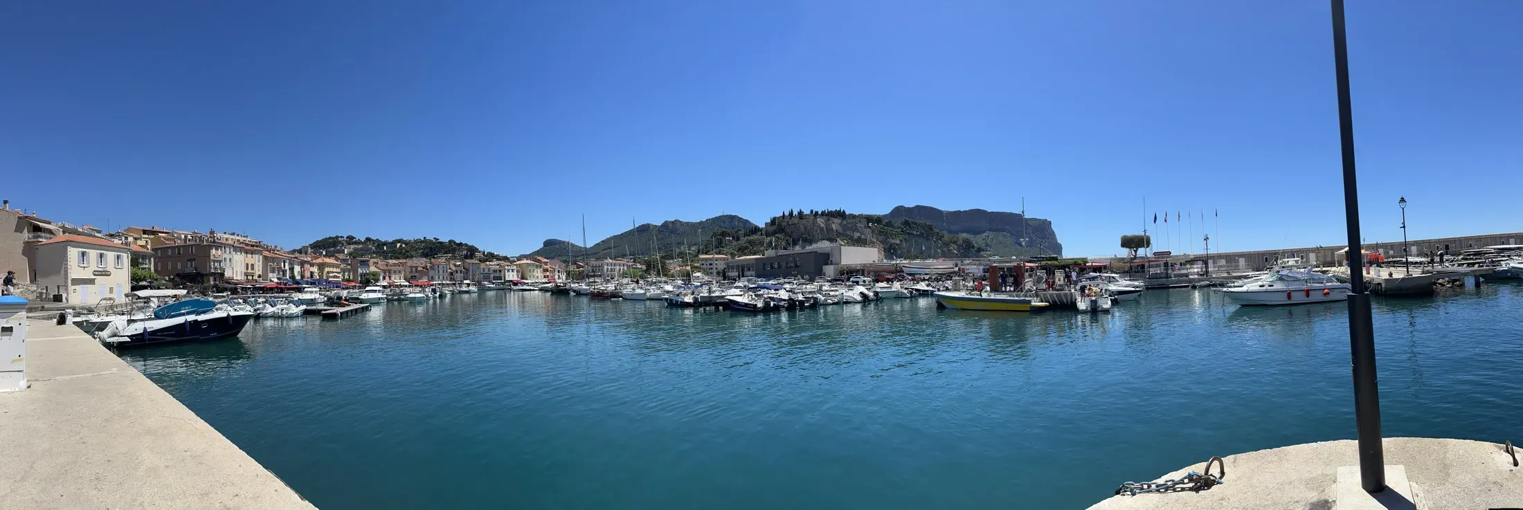 A Mediterranean harbor town along a calm bay
